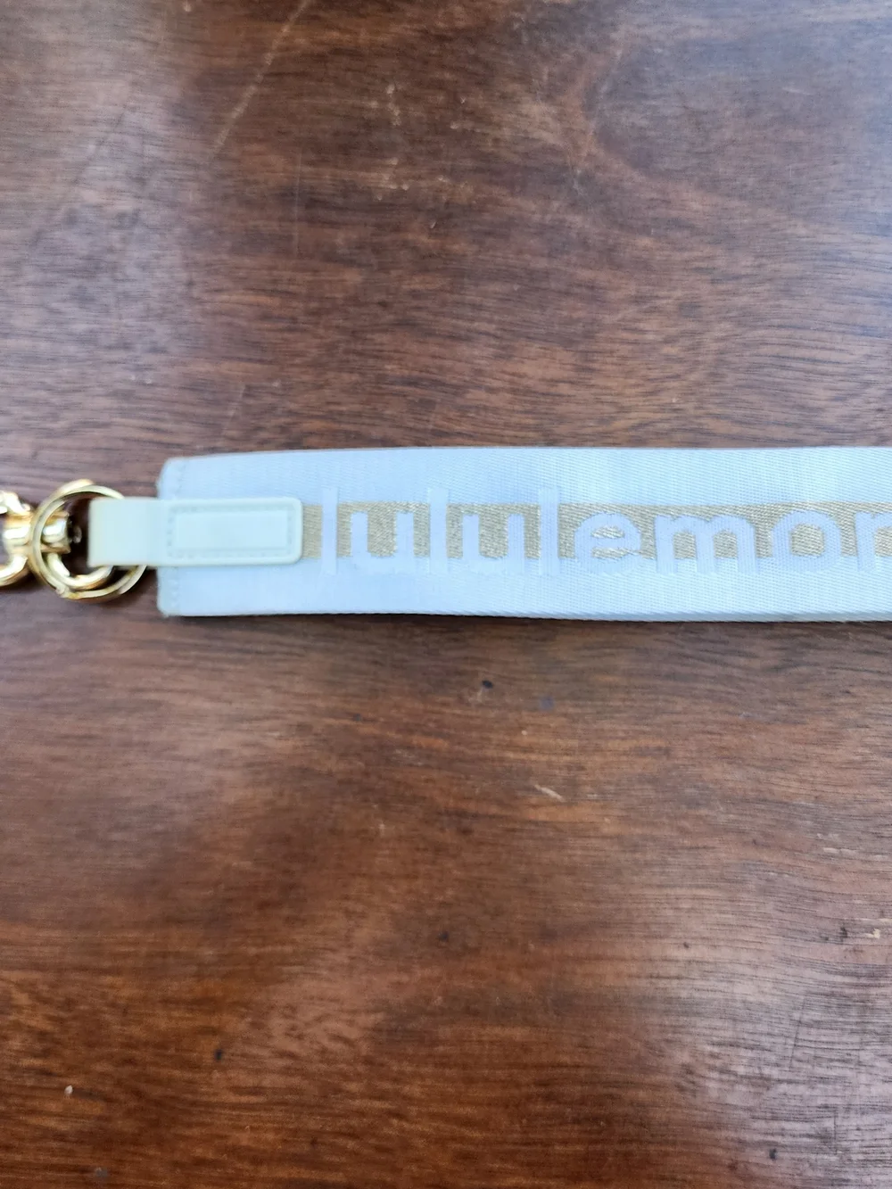 Lululemon Never Lost Keychain Metallic Wordmark Blue Gold NWOT